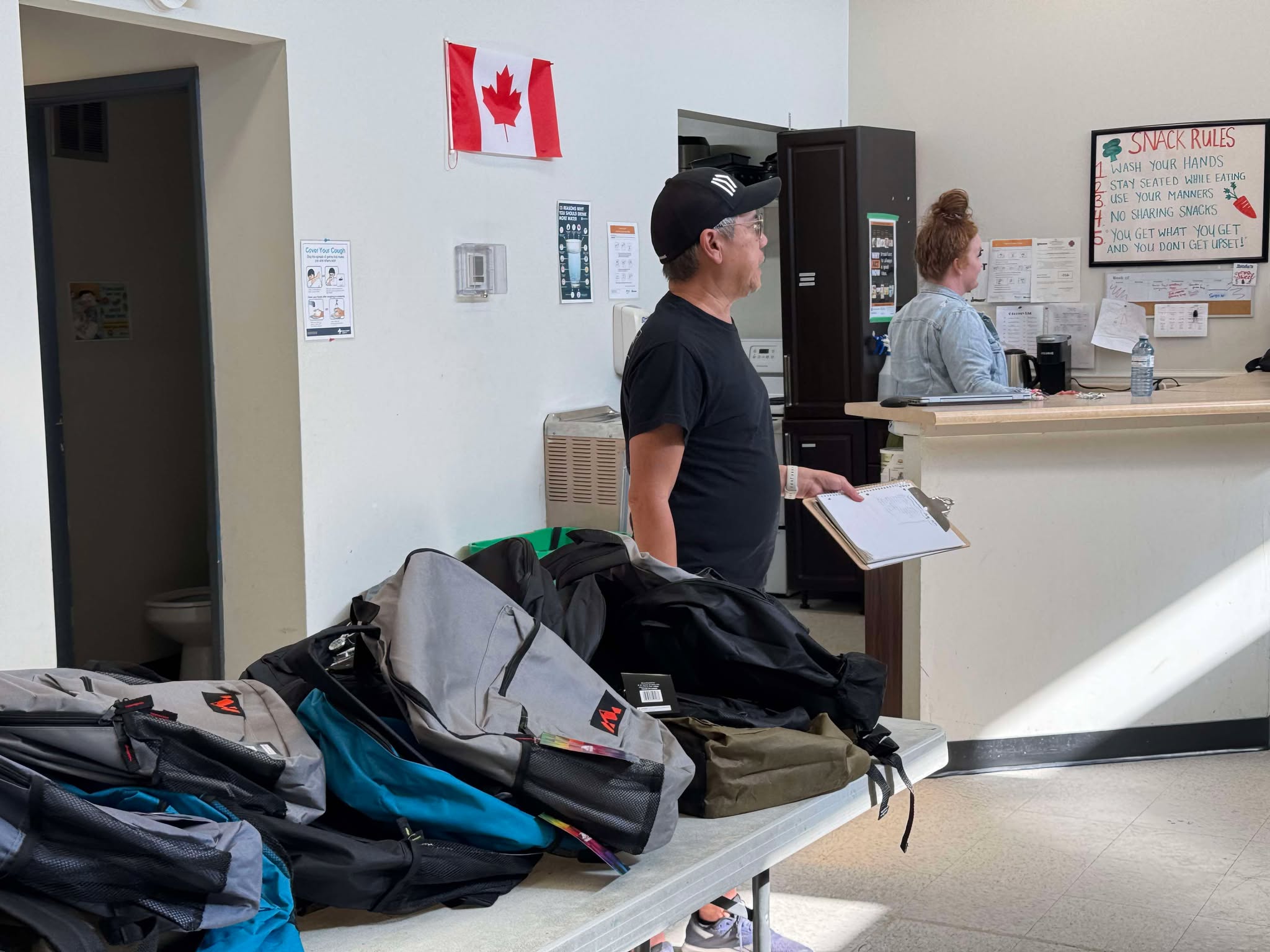 handing out school supplies to the local community